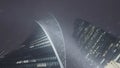 Bottom view of Moscow city towers in snowy cold weather. Action. High skyscrapers with glass windows late in winter Royalty Free Stock Photo