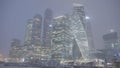 Bottom view of Moscow city towers in snowy cold weather. Action. High skyscrapers with glass windows late in winter Royalty Free Stock Photo