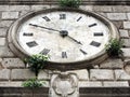 Bottom view of the old clock on the tower in Kotor, Montenegro. Royalty Free Stock Photo