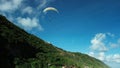 Bottom view of a pair of glider pilots flying on a paraglider, instructor.