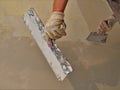 bottom view of a plasterer's hands at work Royalty Free Stock Photo