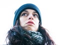 Bottom view of portrait of a cute / beautiful girl looking forward with a hat and scarf