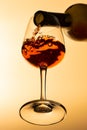 Bottom view of red wine being poured from the wine bottle Royalty Free Stock Photo