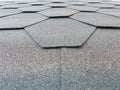 Bottom view of a roof with shingles folded in a hexagon shape.