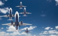 Bottom View of Several Passenger Airplanes Flying In The Blue Sky