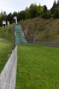 Ski jumping slope and tracks on summer