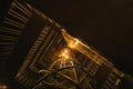 Bottom view. Staircase in futuristic cyber punk style illuminated by pale yellow warm light. Futuristic background