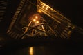 Bottom view. Staircase in futuristic cyber punk style illuminated by pale yellow warm light. Futuristic background