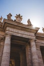 bottom view of statues and arch at St Peters Square