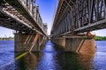 Bottom view of the support beams of the Amur Bridge in Dnipro Ukraine. Architectural-engineering geometric background with copy Royalty Free Stock Photo