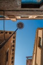 Bottom view of Traditional street lamp at an old Venetian housein the middle of the day with a blue sky