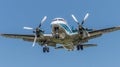 Bottom view - twin prop cargo plane on sky background Royalty Free Stock Photo