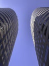 Close up of two skyscrapers against blue sky Royalty Free Stock Photo