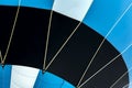 Bottom view of vivid hot air balloon, ready for flight close-up. Texture and pattern, blue, black and white colors Royalty Free Stock Photo