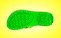 Bottom view of yellow and green rubber male beach slipper sneak