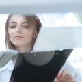 Bottom view.young business woman reading a working paper Royalty Free Stock Photo