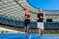 bottom view of young male and female joggers running on track Royalty Free Stock Photo