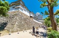 Himeji Castle walls and tourists, white Heron castle