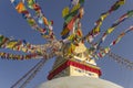 Boudhanath Tibetan Buddhist Stupa with colorful prayer flags against a clear blue sky Royalty Free Stock Photo