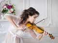 Woman with violin in white peignoir. Boudoir. seductive Royalty Free Stock Photo