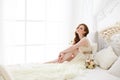 Boudoir Bride`s morning. Cute red-haired girl in her wedding day