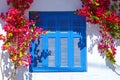 Bougainvillea around a window in Santorini Royalty Free Stock Photo