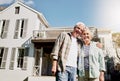 We bought our dream retirement home. a happy senior couple standing together in front of their house. Royalty Free Stock Photo