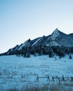 Boulder flatirons landscape covered in snow during a sunny winter day Royalty Free Stock Photo