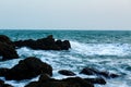 The boulder and wave in the coast sunset Royalty Free Stock Photo