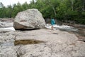 Boulder and Woman on the Sand River Royalty Free Stock Photo