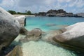 Boulders, beach and azure waters Royalty Free Stock Photo