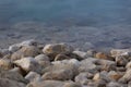 Boulders on blue water edge