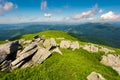 Boulders down the grassy slope of a hill Royalty Free Stock Photo