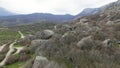 Boulders at foot of mountain. Shot. Drone view of extreme flight over boulders and rocks on mountain slopes. Natural