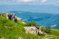 Boulders on a grassy slope Royalty Free Stock Photo