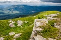 Boulders on a grassy slope of mountain ridge Royalty Free Stock Photo