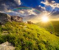 Boulders on hillside in high mountains at sunset Royalty Free Stock Photo