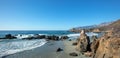 Boulders and rocks strewn over Pacific Valley beach on the Big Sur central California coastline USA