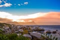 Boulders is a turqoise rocky and sheltered beach in cape town taken as sunset