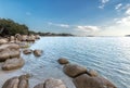 Boulders in a turquoise sea at Santa Giulia beach in Corsica Royalty Free Stock Photo