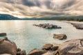 Boulders in a turquoise sea at Santa Giulia beach in Corsica Royalty Free Stock Photo