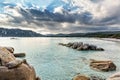 Boulders in a turquoise sea at Santa Giulia beach in Corsica Royalty Free Stock Photo