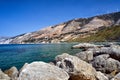 Boulders and windmills of the mountainous sea shore on the island of Kefalonia