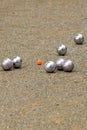 Boules game with silver bowls and a red ball. Various ball games such as pÃÂ©tanque, but also boccia