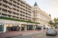Boulevard de la Croisette street view with luxury shops and Intercontinental Carlton hotel in Cannes France