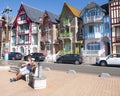 Boulevard with people and colorful houses of mers les bains in french normandy