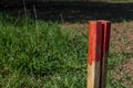 Boundary post and boundary stone in the field Royalty Free Stock Photo