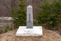 A boundary stone marks the US/Canada border