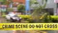 Boundary Tape and defocused squad car at Crime scene Royalty Free Stock Photo