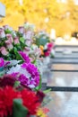 Bouqets of flowers laying on gravestones